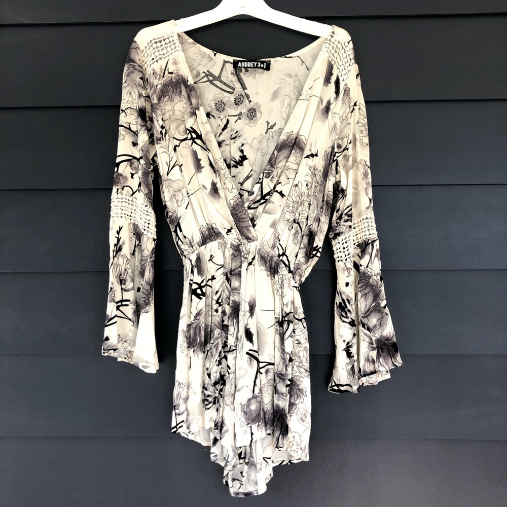 Long sleeved black and white floral romper